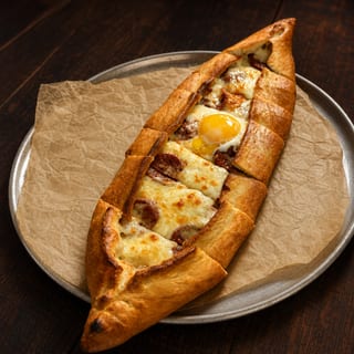 Pide with sucuk stone baked